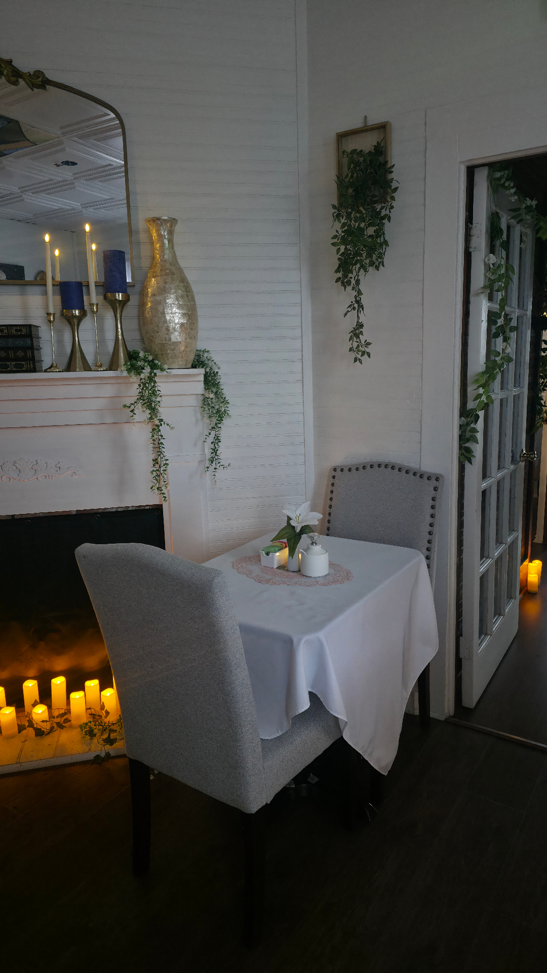 Candlelit fireplace with cozy table for two