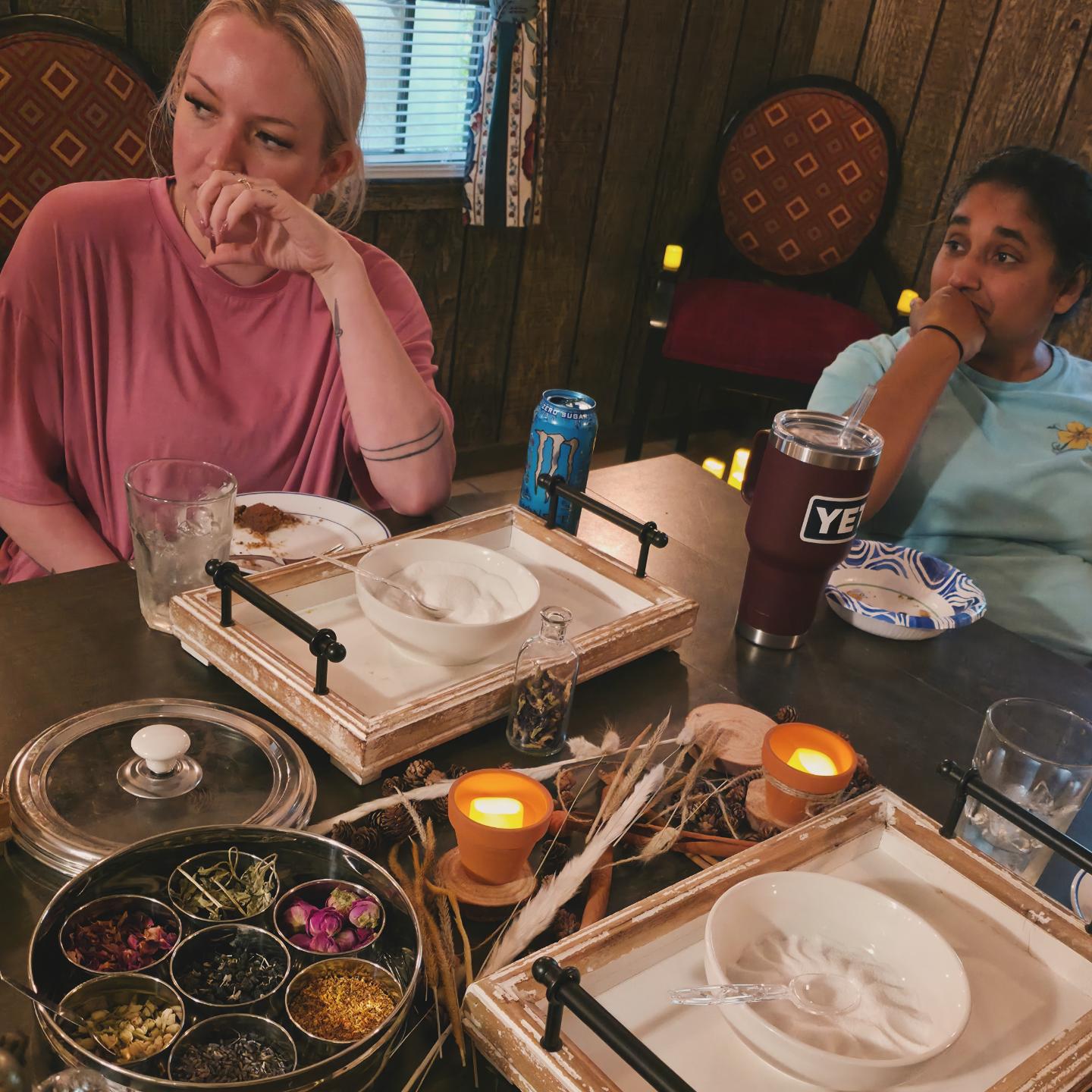Guests smelling their botanical blends at the table