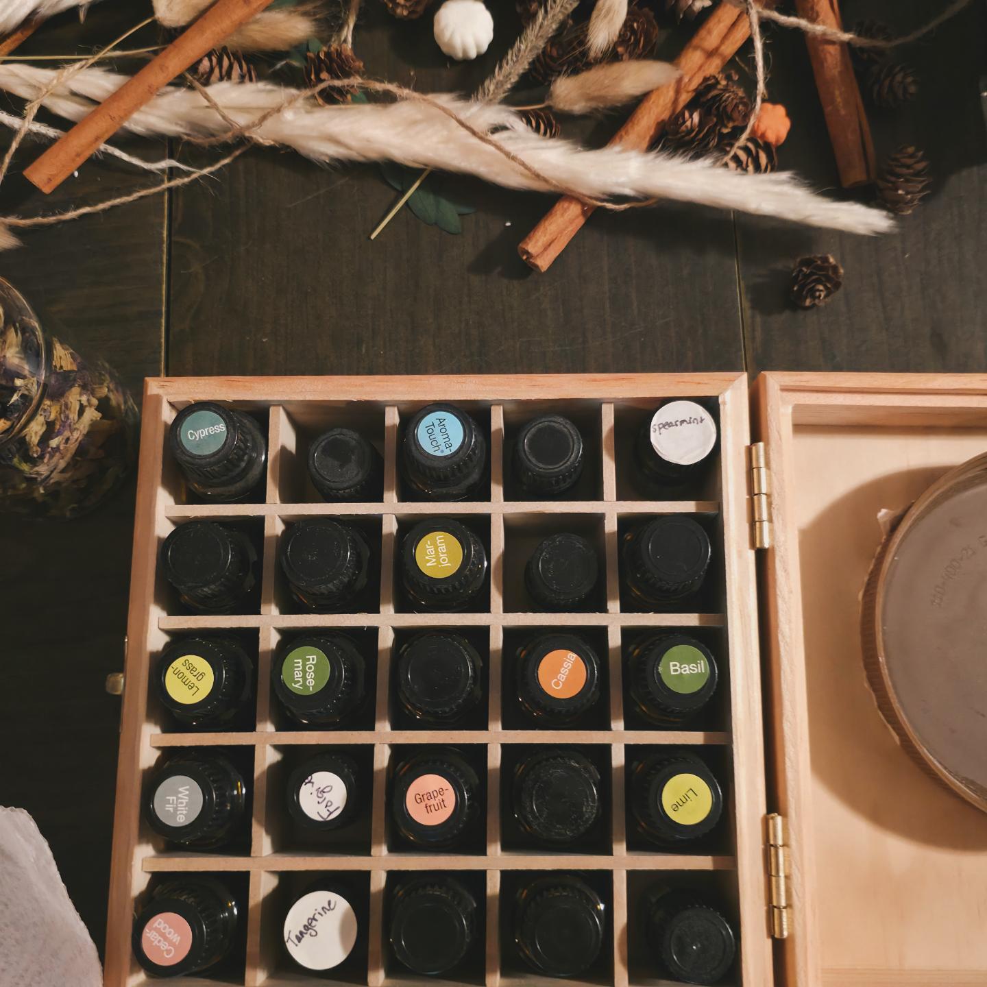 Wooden case of labeled essential oil bottles