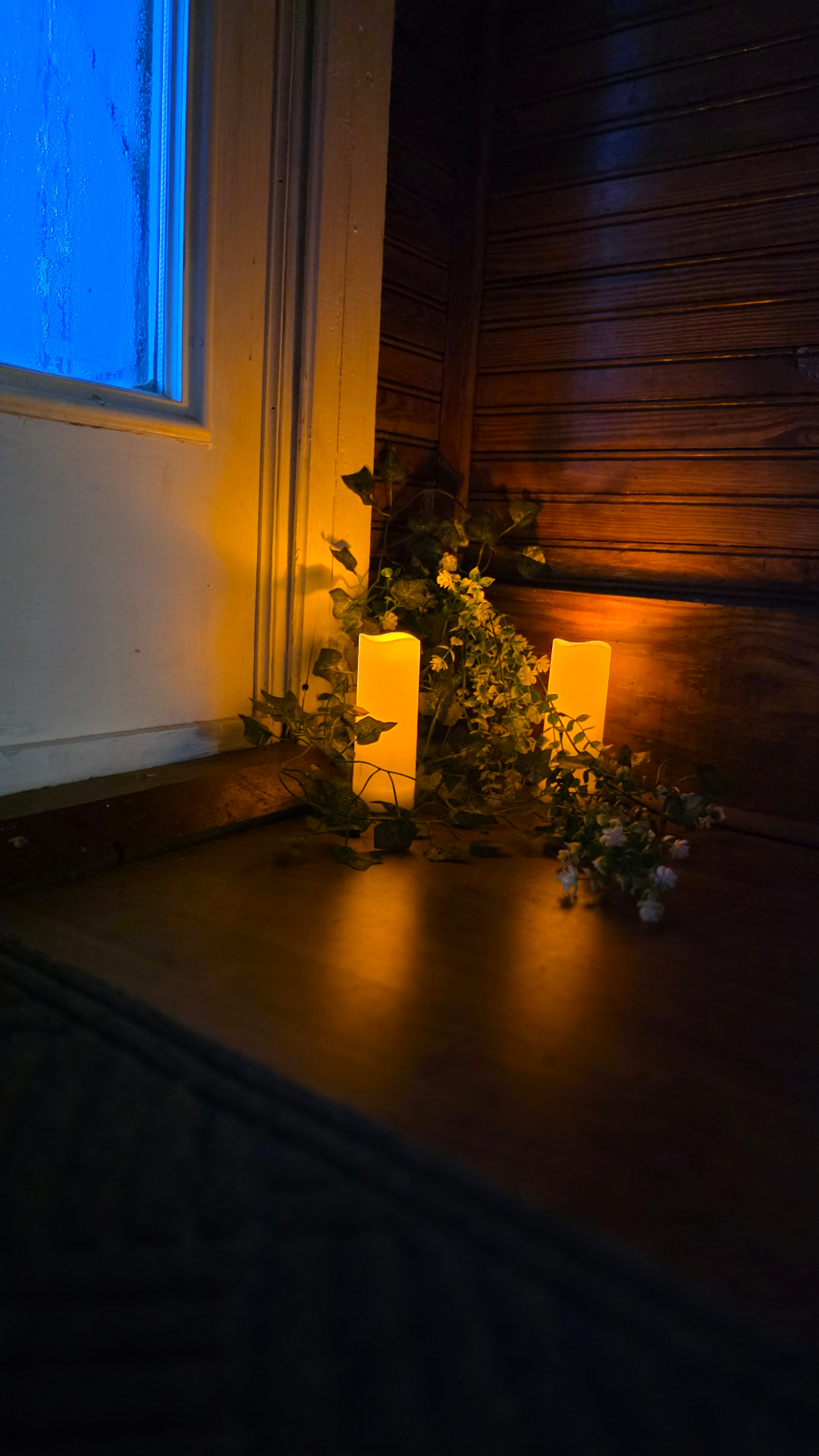 Flameless candles tucked by the window